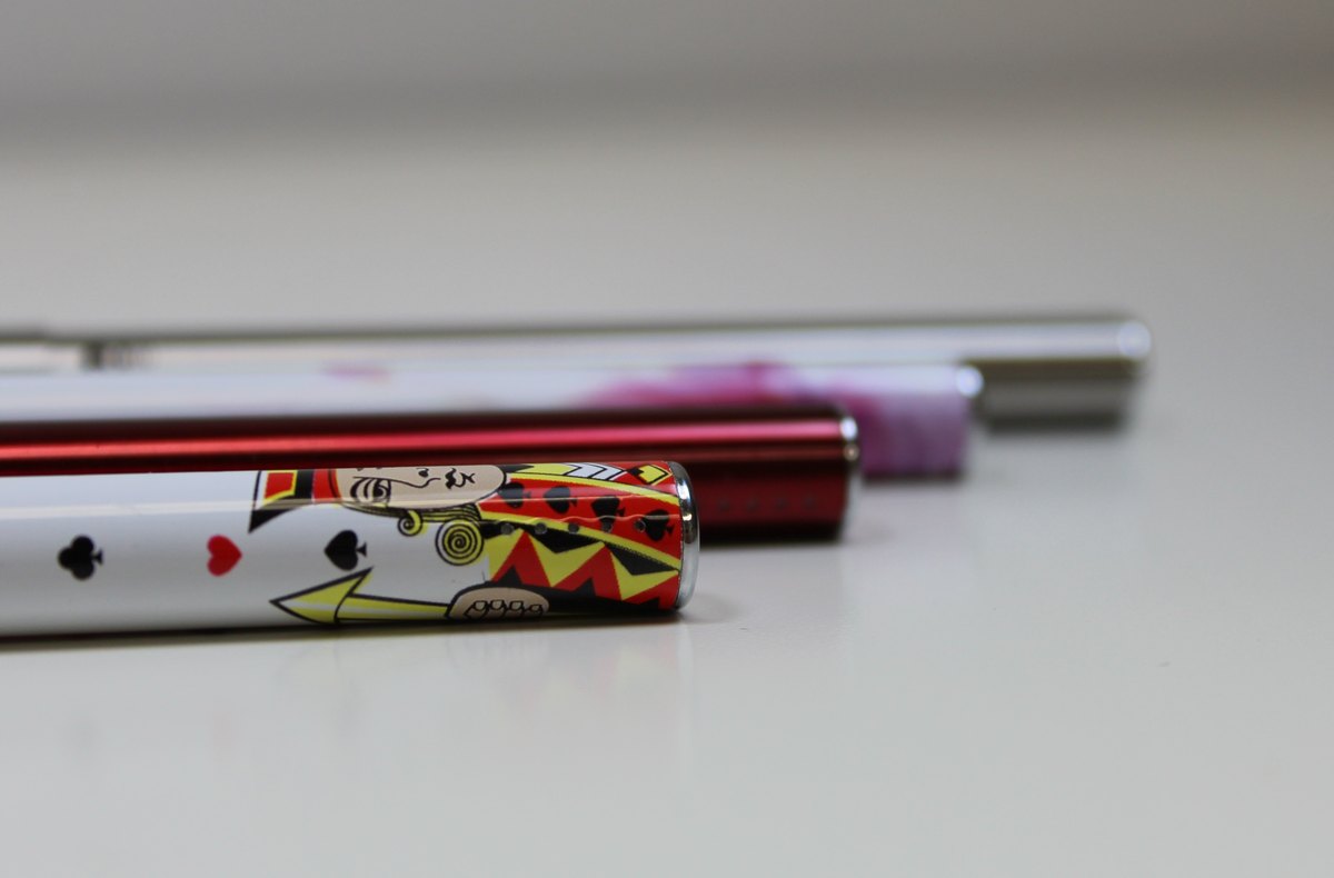 Row of colorful cylindrical vape batteries