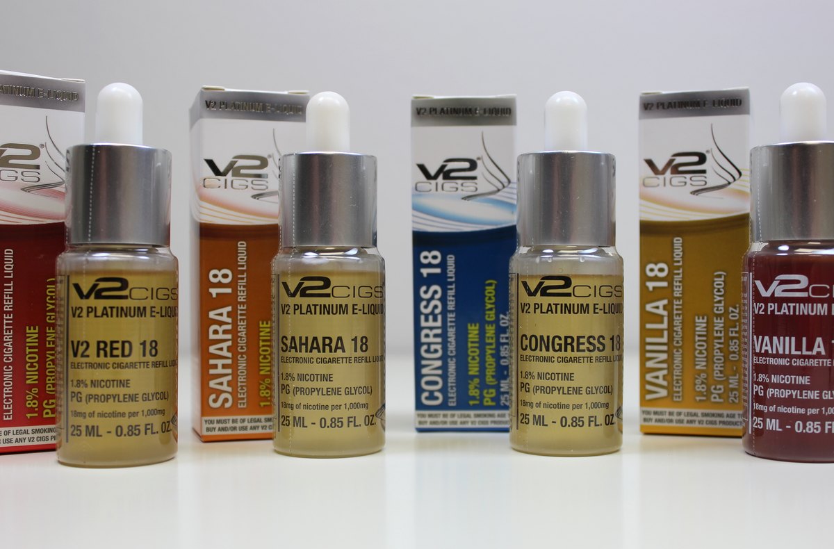 Several labeled bottles of e-liquid