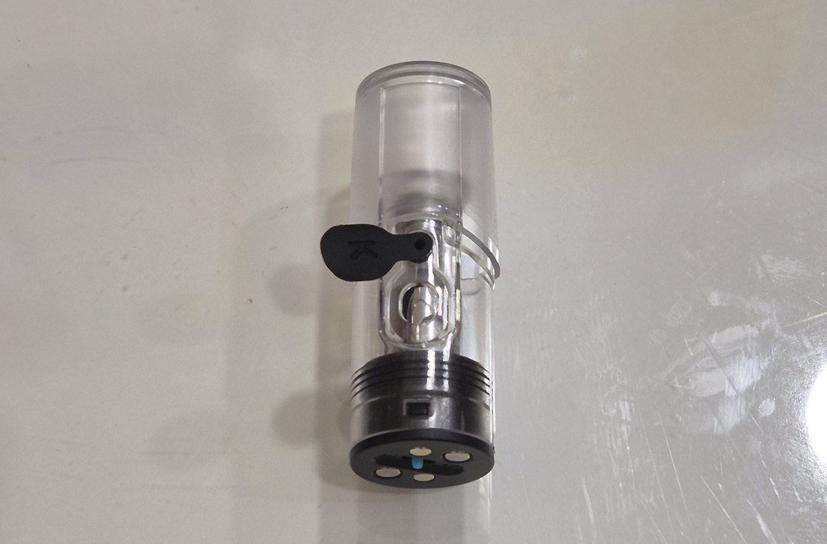 Blue refillable pod cartridge viewed from the side