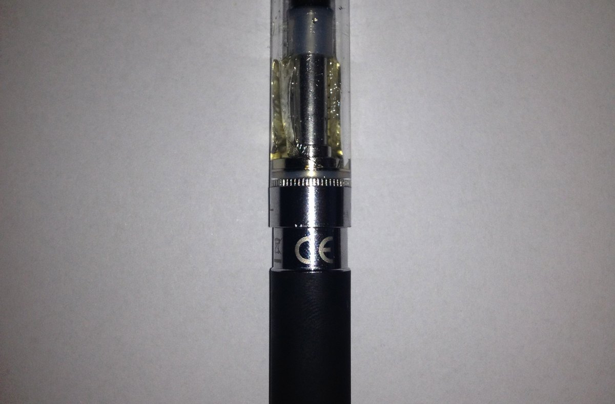 Slim electronic cigarette device on a dark surface