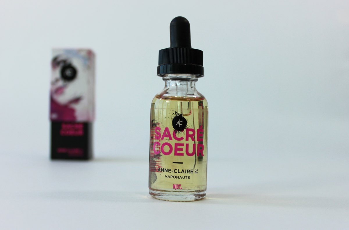 Close-up of an e-liquid bottle and dispensing nozzle