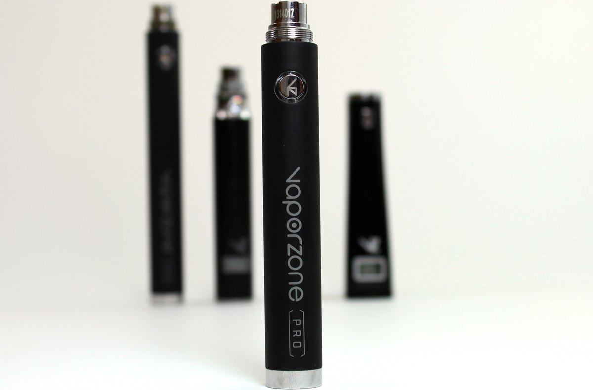 Several refillable vape devices standing upright